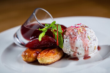 Ice-cream and biscuits and red syrup
