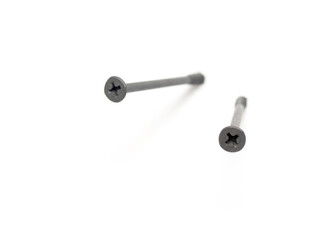 metal screws with long dark thread on white background