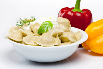 Cooked dumplins Ravioli and paprika