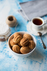 Ball cookies and tea on blue background