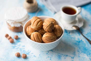 Ball cookies and tea on blue background