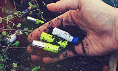 batteries on ground, concept of toxic waste