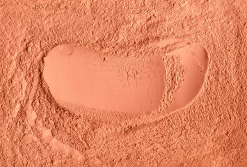 Red terracotta bentonite clay powder. Natural beauty treatment and spa. Clay texture close up,...
