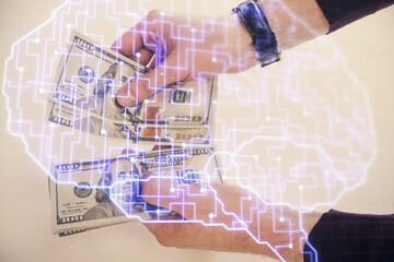 Fototapeta na wymiar Multi exposure of brain drawing hologram and us dollars bills and man hands. Ai invest concept