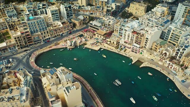 Aerial view of St. Julians city, Balluta Bay Beach and new building. Malta island