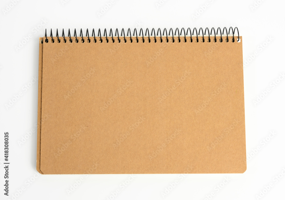 Poster closed notepad with brown sheets on a white background