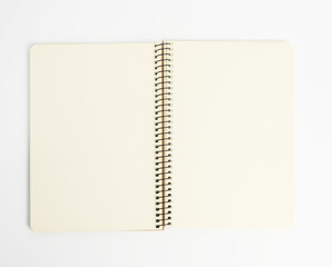 open spiral notepad with blank white sheets on white background