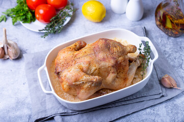 Whole baked chicken in sea salt. Home cuisine, traditional dish. Close-up.