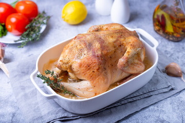 Whole baked chicken in sea salt. Home cuisine, traditional dish. Close-up.