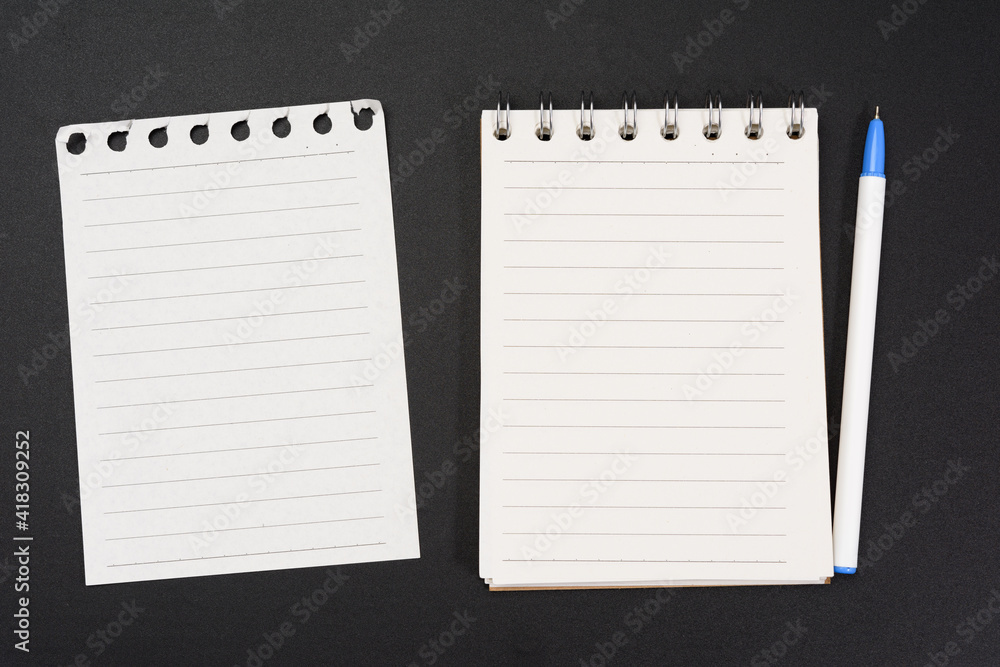 Poster notebook with white sheets in a line on a black background