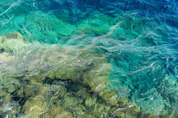 Clear sea surface with sea stones