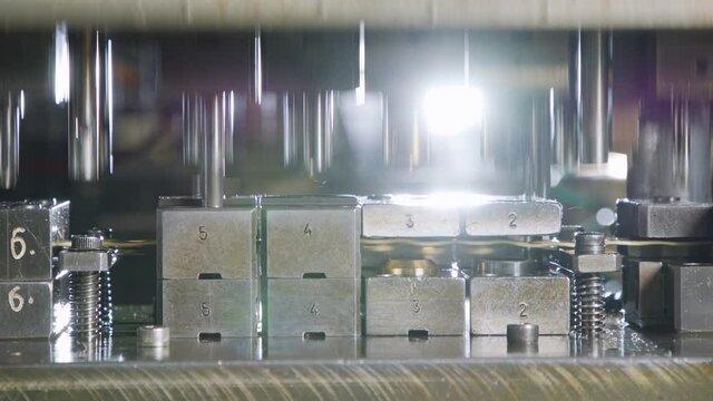 A large industrial punch press forming sheet metal parts