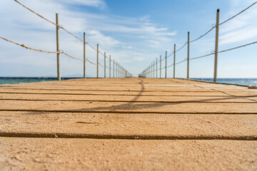 Empty wooden pier over the sea at summer