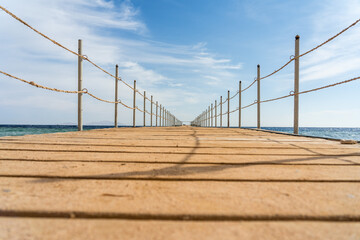 Empty wooden pier over the sea at summer