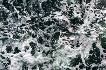 white foam in the ocean water background