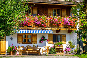 typical bavarian frontyard at a farmhouse near the alps