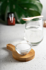 selective focus. Collagen powder in a glass container. light background. copyspace. Extra protein intake. Natural beauty and Health supplement for skin, bones, joints and intestines