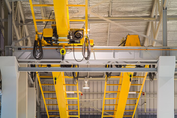 Overhead crane inside factory or warehouse. That industrial machinery or lifting equipment consist...