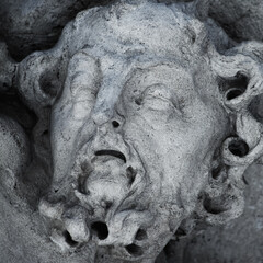 Fragment of ancient statue of Sisyphus with stone. God Zeus punished Sisyphus: he had to roll very...