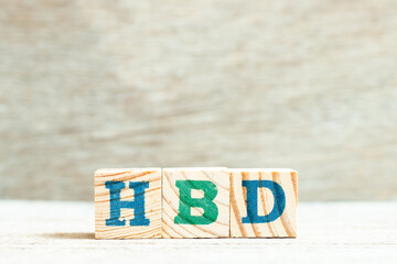Alphabet letter block in word HBD (Abbreviation of happy birthday) on wood background