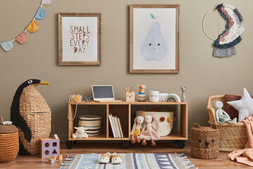 Stylish scandinavian kid room interior with toys, teddy bear, plush animal toys, mint armchair, furniture, decoration and child accessories. Brown wooden mock up poster frames on the wall. Template - obrazy, fototapety, plakaty
