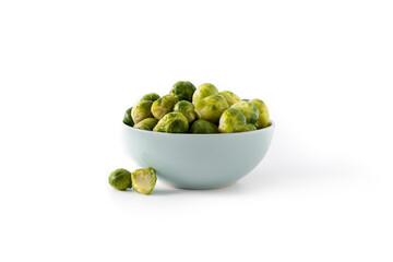 Set of brussel sprouts in a bowl isolated on white background