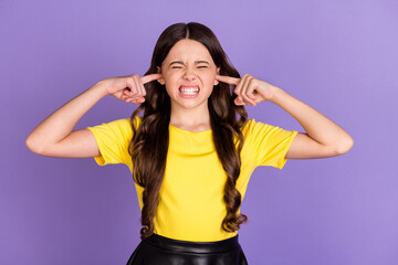 Obraz na płótnie Canvas Portrait of nice stressed brunette hairdo girl cover ears wear yellow t-shirt isolated on vivid lilac color background