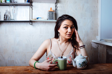 a girl with a smile drinks coffee for breakfast