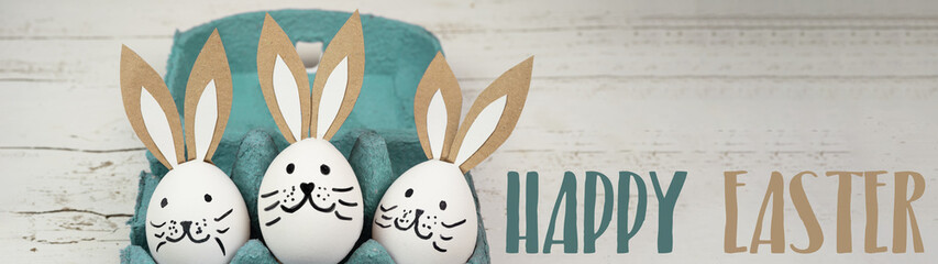 Happy Easter background banner panorama greeting card -Close-up from white painted eggs and easter...