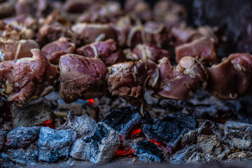 Fresh shish kebab on skewers is fried on the grill. Grilled meat on skewers.