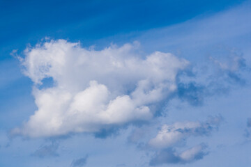 Naklejka na ściany i meble Beautiful white clouds against the blue sky
