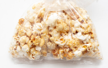 Popcorn in a plastic bag as a background.