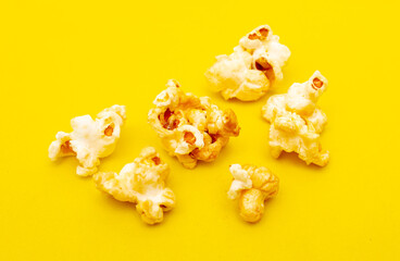 Close-up of popcorn on a yellow background.