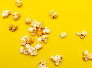 Close-up of popcorn on a yellow background.