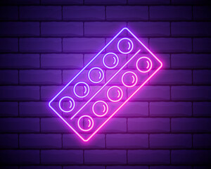 Glowing neon line Pills in blister pack icon isolated on brick wall background. Medical drug package for tablet vitamin, antibiotic, aspirin. Vector Illustration