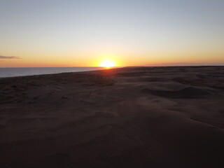 dunes in monte hermoso atlantic coast of Argentina, golden sand, photos with drone, sunset over sea