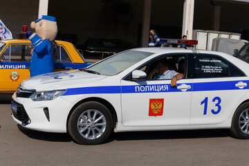 Russian police patrol car, on a city street on a summer day. © tramp51