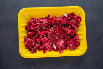 A box of fresh cut chicken kidney flowers