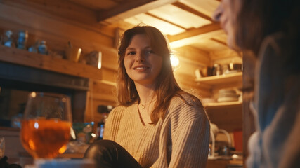 Young women, best friends having a drink in the bar during the winter vacation. High quality photo