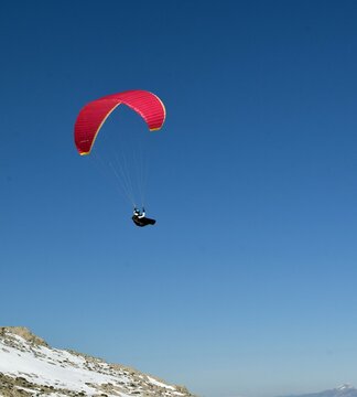Ski trail in a ski resort and skier