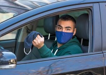 health protection, safety and pandemic concept,taxi driver with cottone mask