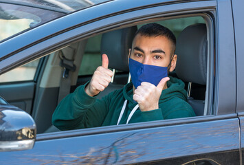 health protection, safety and pandemic concept,taxi driver showing thumbs up sign