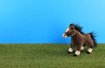 toy pony on artificial grass