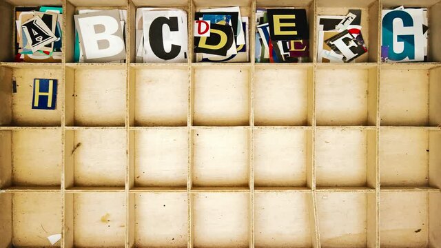 Stop motion Alphabet with cut out magazine letters from above