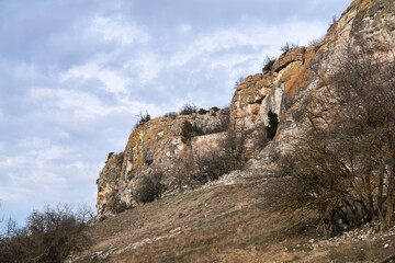 winter landscape of central Crimea with rocky cliffs at the edge of the cuesta and ancient fortress...