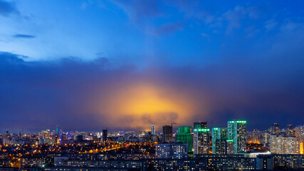 Vysotsky building in Yekaterinburg on the background of storm clouds at night 2