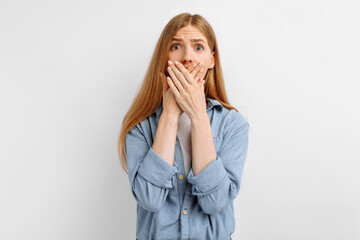 Portrait of a frightened woman, on an isolated white background