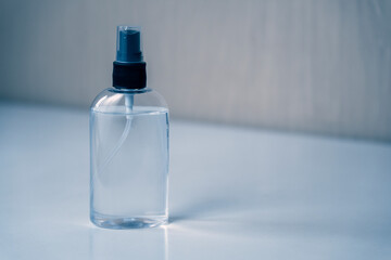 Hand sanitizer with clear antiseptic to protect against coronavirus. Corona virus COVID-19 spread protection. Soft focus