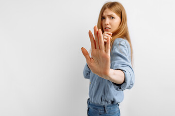 Portrait of a frightened woman, on an isolated white background