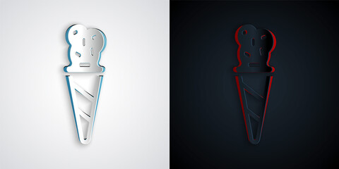 Paper cut Ice cream in waffle cone icon isolated on grey and black background. Sweet symbol. Paper art style. Vector.